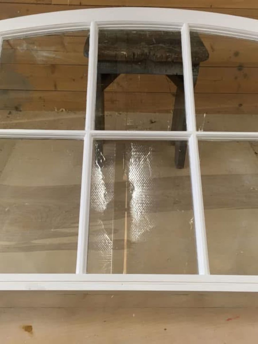 The arched sash re-jointed, primed and painted