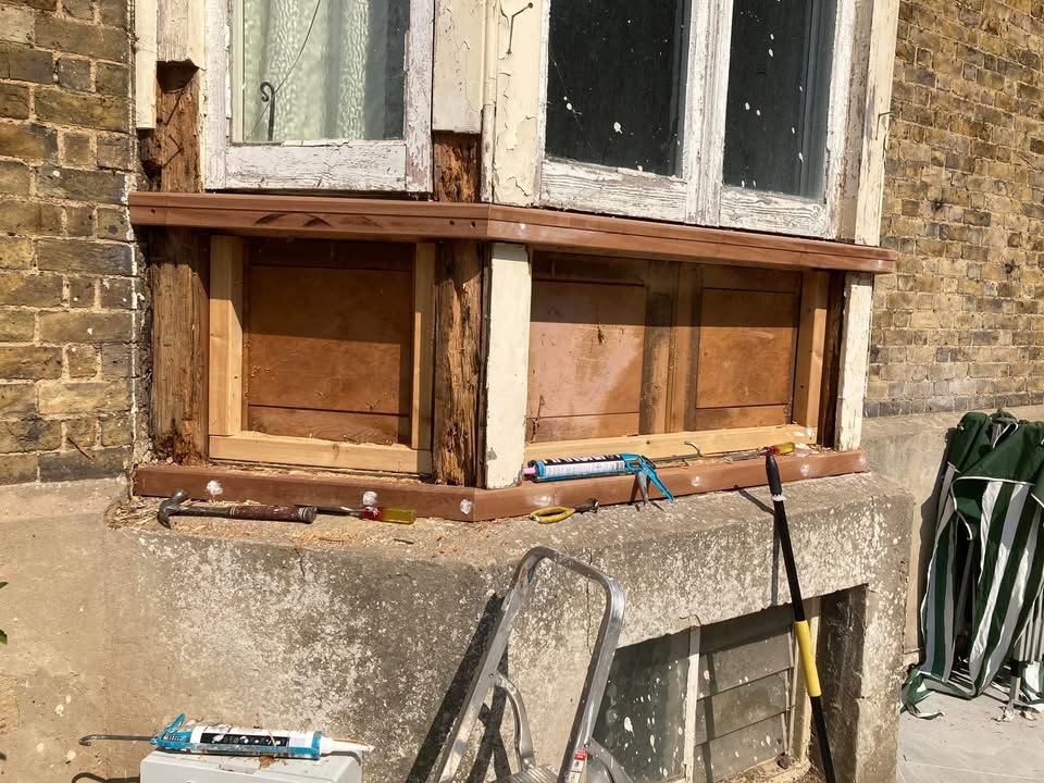 Bay window panelling rebuilt in new timber