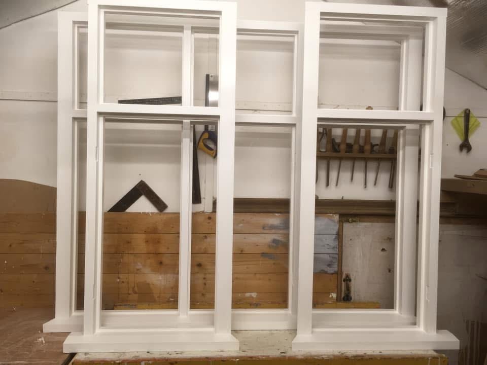 Two new box sash windows primed white
