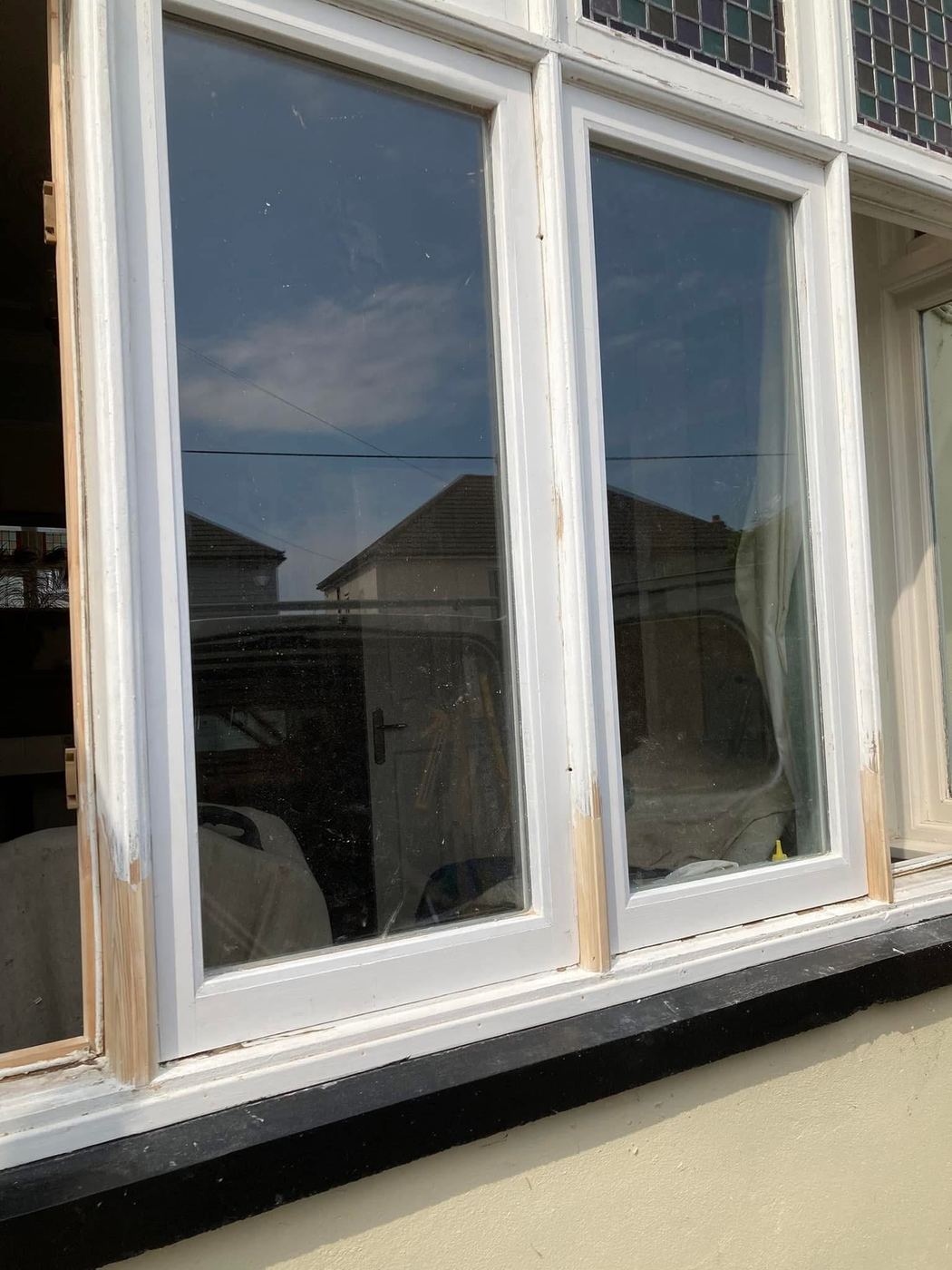 The casement bay window repaired and painted