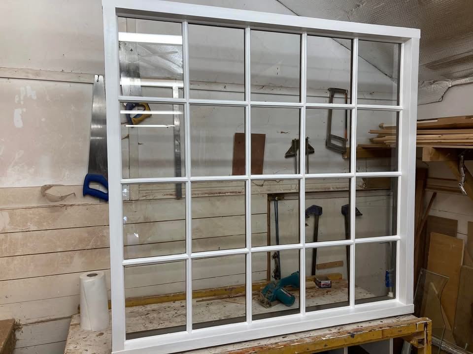 The multi-pane window painted in the workshop